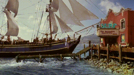 Large Sailboat Docked at Surf Shop