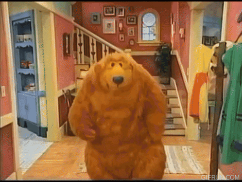 Large Teddy Bear Standing In Hallway GIF