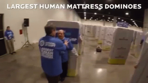 Largest Human Mattress Dominos Falling GIF