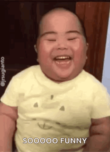 Laughing and Smiling Baby in Yellow T-Shirt