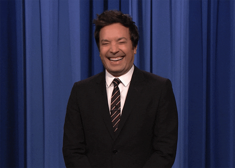 Laughing Jimmy Fallon Shrugs GIF
