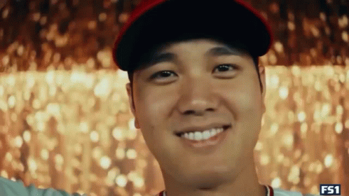 Laughing Man Covering Ears In Mirror GIF
