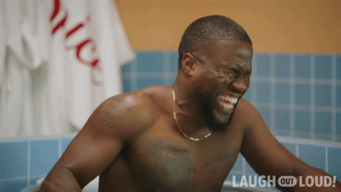 Laughing Shirtless Man in Bathtub