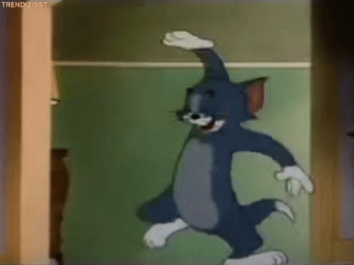 Laughing Tom Cat Hitting His Knee GIF