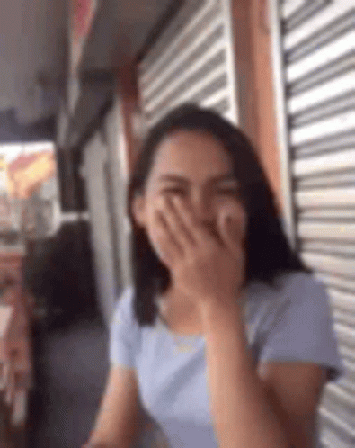 Laughing Women Covering Mouth With Missing Teeth GIF
