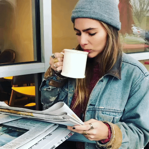 Lauren Jenkins Reading Newspaper And Drinking Espresso GIF