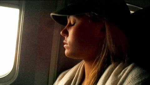 Lauren Waking Up On Plane GIF