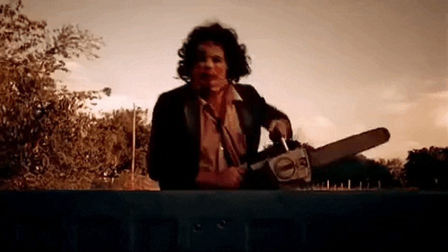 Leatherface Chasing With Chainsaw GIF