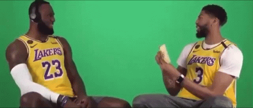 Lebron James And Anthony Davis Are Sitting Next To Each Other On A Green Screen . GIF