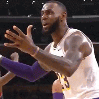 Lebron James Is Making A Funny Face While Playing Basketball In A Game . GIF