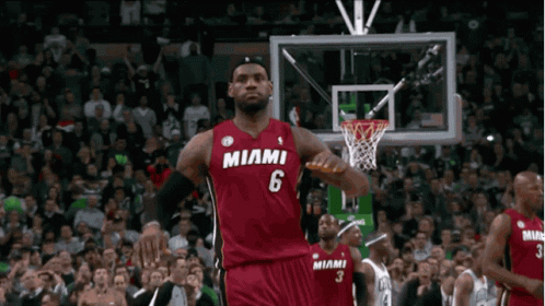 lebron james is wearing a miami jersey while playing basketball