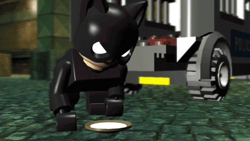 Lego Batman Looking at Food in Front of Police Car