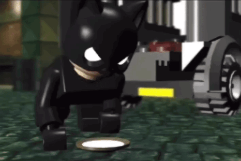 Lego Batman Standing Next to Plate