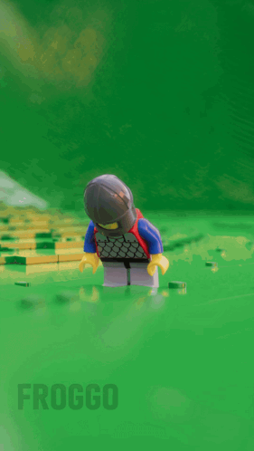 Lego Knight Standing on Green Surface
