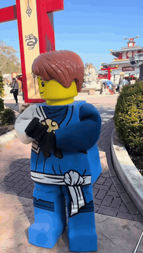 Lego Ninjago Character Beside Dragon Sign GIF