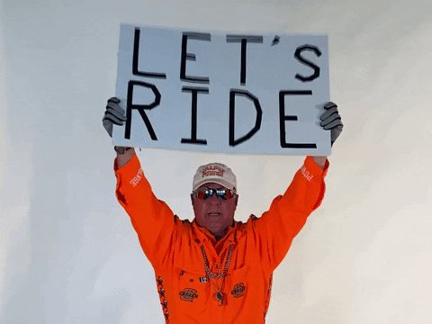 Let's Ride Man Holding A Signboard GIF