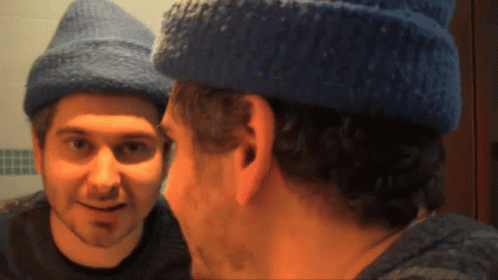 Level Up Man Talking On Reflection GIF
