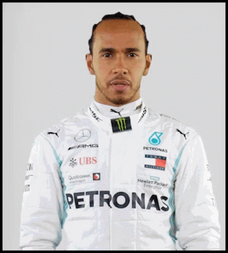 Lewis Hamilton Is Wearing A White Jacket With Logos For Ubs And Petronas GIF