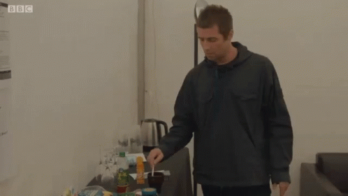 Liam Gallagher Stirring Cup Of Drink GIF