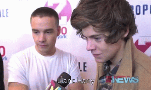 Liam Harry Talking Into Microphone At News GIF