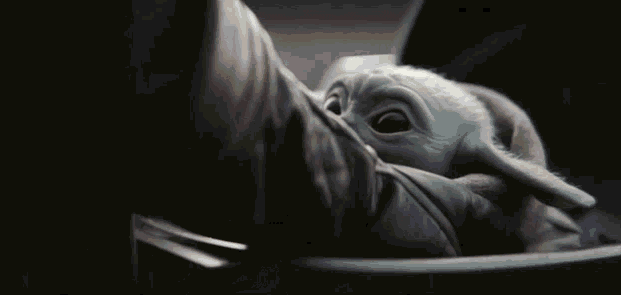 Lifting Baby Yoda GIF