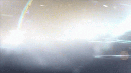 Light Shining Through Cloudy Sky With Rainbow GIF