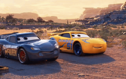 Lightning Mcqueen And Rusteze Are Standing Next To Each Other In The Desert GIF