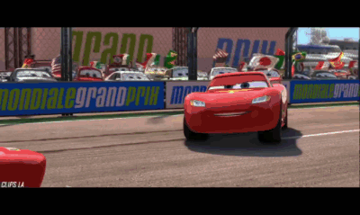 Lightning Mcqueen Is On A Race Track With A Sign That Says Mondiale Grand Prix GIF