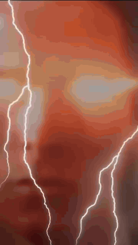 Lightning Strikes Against Red Background