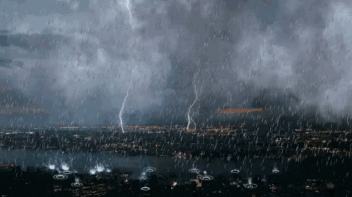 Lightning Strikes In A Storm Over A City At Night GIF