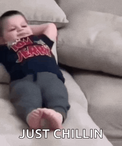 Lil Kid Chilling Chilling On Couch Gif GIF