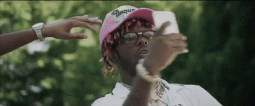 Lil Uzi Vert Holding Smartphone GIF