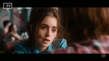 Lily Collins Looking Down While Listening GIF