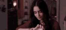 Lily Collins Playing With Her Fingers GIF