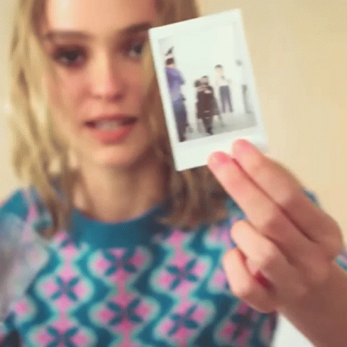 Lily Depp Holding Polaroid Photo GIF