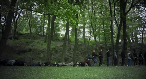 Lining People Like Dominos Falling GIF