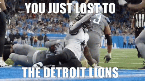 Lion Mascot In Blue Shirt And White Shorts GIF