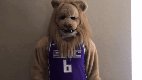Lion Mascot In Purple Jersey Number 6 GIF