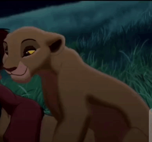 Lioness Sitting In Grass At Night GIF