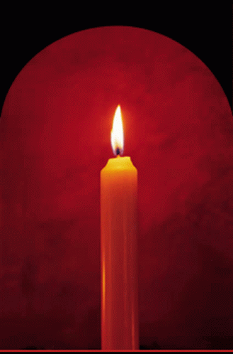 Lit Candle on Red Background