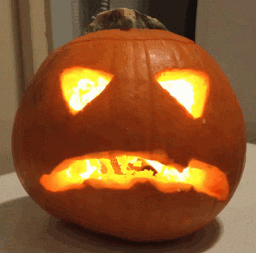 Lit Pumpkin With Carved Face