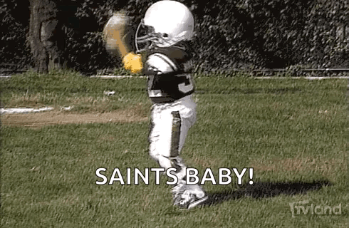 Little Boy Dressed as Football Player Holding Baseball Glove