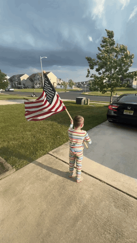 Little Boy Holding American Flag