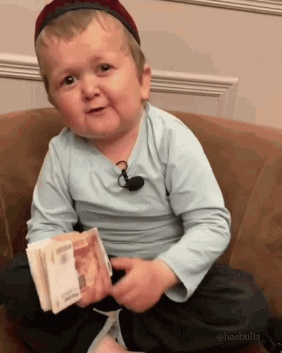 Little Boy Holding Pile of Money