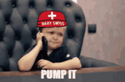 Little Boy in Baby Swiss Hat Talking on Cell Phone