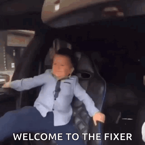 Little Boy in Back Seat With Welcome to the Fixer