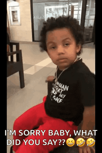 Little Boy in Black Shirt Saying I'm Sorry Baby What Did You Say