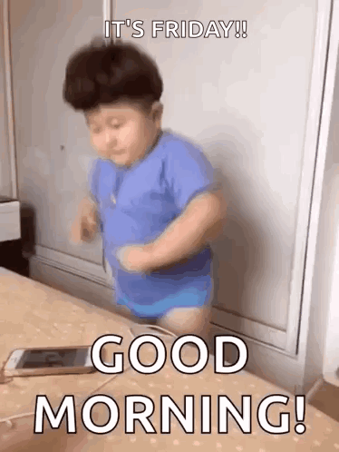 Little Boy in Blue Shirt Dancing on Bed With Cell Phone