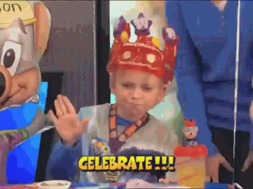Little Boy in Crown Says Celebrate
