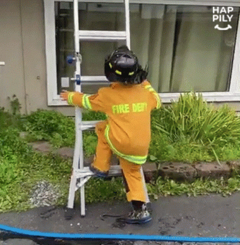 Little Boy In Fire Dept Uniform Climbing Ladder GIF
